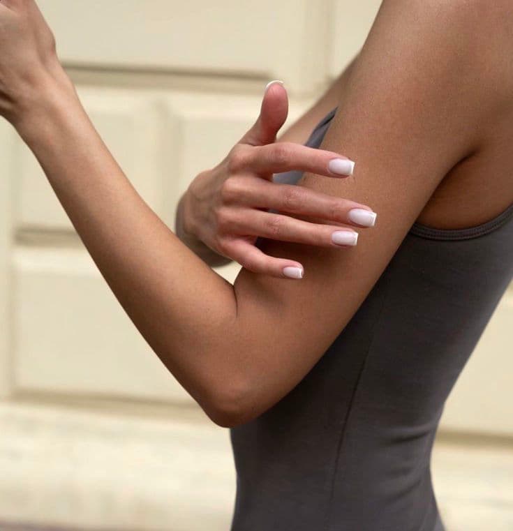 Square French tip nails, elegant pose
