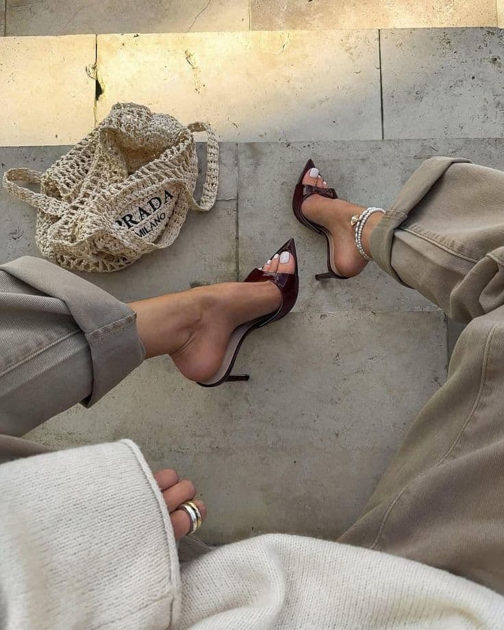 Prada lifestyle, burgundy pedicure on marble